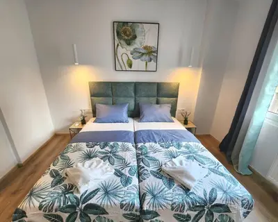 a bedroom with a bed with two pillows on it at Lux House Attiki VIPGreece in Athens