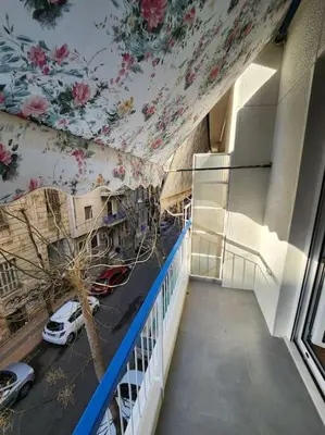 a balcony with a mural of flowers on the ceiling at Lux House Attiki VIPGreece in Athens
