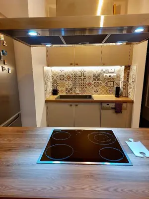 a stove top oven sitting on top of a kitchen counter at Christina-Anna Athens City Center walking distance to everywhere and Acropolis, in One of the most Favorable Locations by National Gardens and Zoo, Hellenic Parliament in Syntagma and Stylish Exquisite Kolonaki Cozy Renovated Apartment in Athens