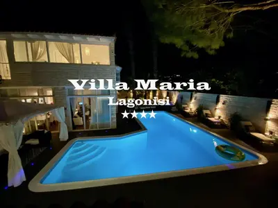 a swimming pool in front of a house at night at Villa Maria Lagonissi - Private Villa upstairs with exclusive access to pool & outside areas in Kalívia Thorikoú