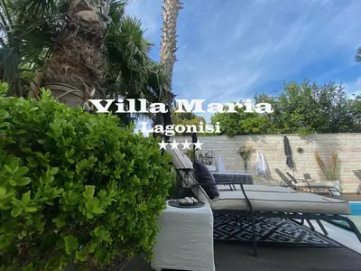 a villa with a swimming pool and a villa argolis sign at Villa Maria Lagonissi - Private Villa upstairs with exclusive access to pool & outside areas in Kalívia Thorikoú