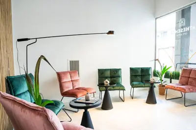 a group of chairs in a waiting room at Athesense Suites in Athens