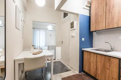 a kitchen with a sink and a desk in a room at Laskareos Apartment by Olala Homes in Athens