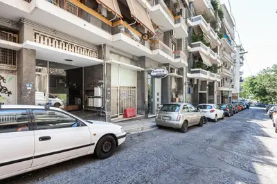 a group of cars parked on the side of a street at Laskareos Apartment by Olala Homes in Athens