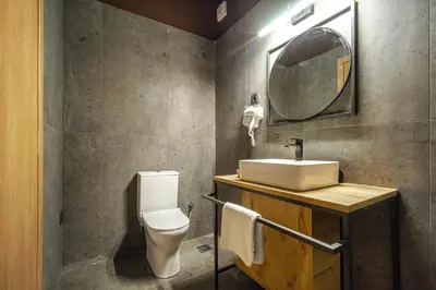 a bathroom with a sink and a toilet at Karma Athens II in Athens