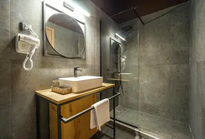 a bathroom with a sink and a shower at Karma Athens II in Athens