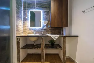 a bathroom with a sink and a mirror at Karma Athens II in Athens