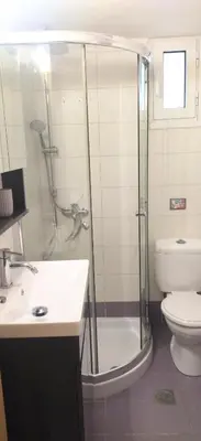 a bathroom with a shower and a sink and a toilet at City stay Ambelokipi Panormou '' cozy apartment'' in Athens