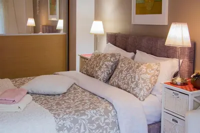 a bedroom with a bed with two pillows on it at City stay Ambelokipi Panormou '' cozy apartment'' in Athens