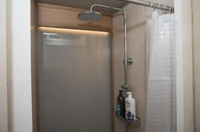 a bathroom with a shower with a shower curtain at Syntagma View Apartment in Athens