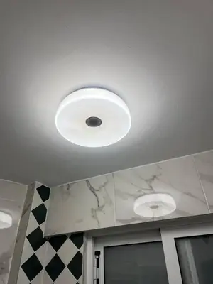 a ceiling with a light fixture on a ceiling at Luxurious 2-Bed Seaside Apartment in Saronida in Saronida