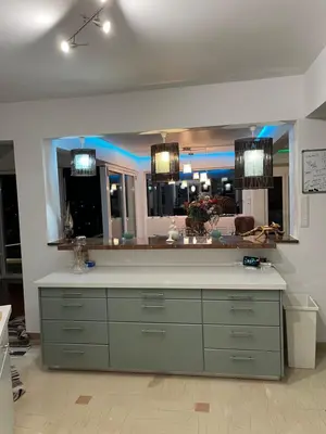 a kitchen with a counter and a large mirror at Luxurious 2-Bed Seaside Apartment in Saronida in Saronida