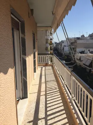 a balcony with a view of a building at Andromaxi 2BR Apt near SNFCC, AC, WiFi in Athens