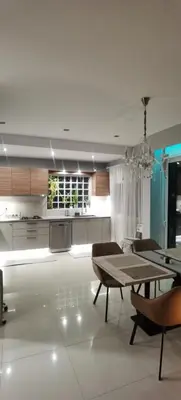 a kitchen with a table and a dining room at Divine Home Beach Retreat in Anavissos