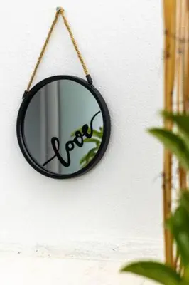 a mirror hanging on a wall with the word pivot at Athens Acropolis View in Athens
