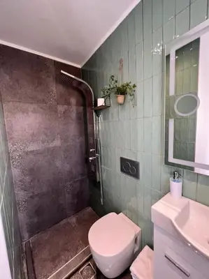 a bathroom with a toilet and a sink at Athens Acropolis View in Athens