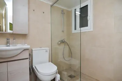a bathroom with a shower and a toilet and a sink at Athens Stylish next to Acropolis, Metro stop Fix in Athens
