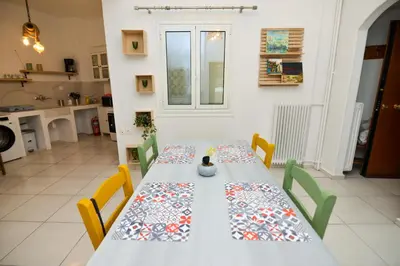 a table in a kitchen with a table cloth on it at Athens Stylish next to Acropolis, Metro stop Fix in Athens