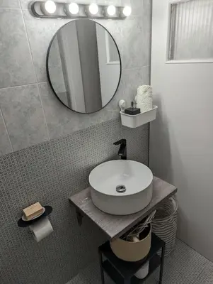 a bathroom with a sink and a mirror at Cozy apartm.near Metro Ag.Marina in Athens