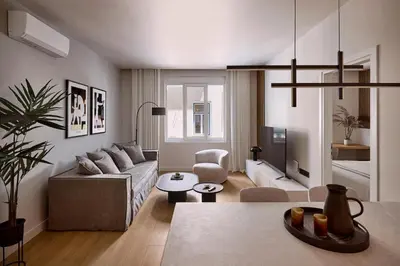 a living room with a couch and a table at Lime Residences, Syntagma by Aura Homes in Athens