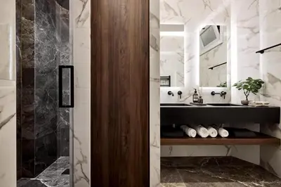 a bathroom with a sink and a shower at Lime Residences, Syntagma by Aura Homes in Athens