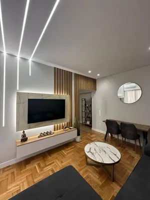 a living room with a flat screen tv on a wall at Mihaela-Andreea Luxury House in Athens