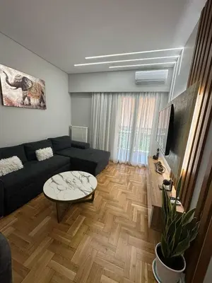 a living room with a couch and a table at Mihaela-Andreea Luxury House in Athens
