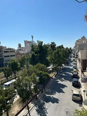 a street with cars parked on the side of the road at Mihaela-Andreea Luxury House in Athens