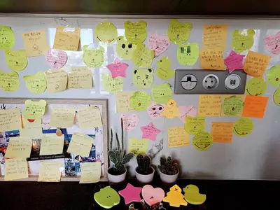 a bulletin board with sticky notes on a wall at Quiet house-Athens Center 100 meters balcony on the top floor in Athens