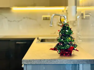 a small christmas tree sitting on top of a kitchen counter at Quiet house-Athens Center 100 meters balcony on the top floor in Athens