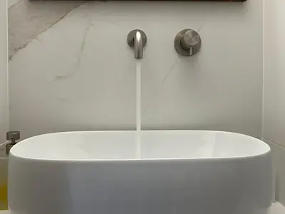 a white bath tub with water coming out of it at Sunny Apartment in Koukaki - Excellent spot in Athens