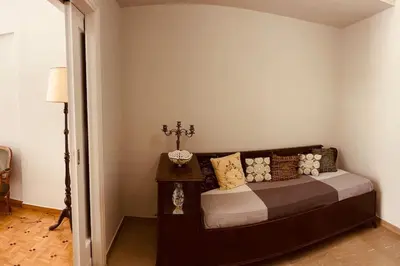 a bedroom with a bed in a room at Grandma's Apartment in Athens
