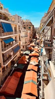 a group of boats lined up on a city street at Grandma's Apartment in Athens