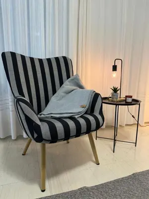 a black and white chair sitting next to a table at WINDSOR PLACE APARTMENT - KEYLESS ENTRY with code in Athens