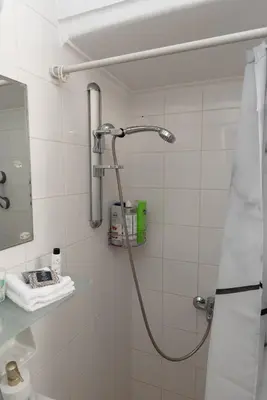 a shower in a bathroom with a shower head at Bluehouse in Porto Rafti