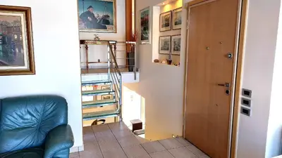 a hallway with a stairway leading to a room at Luxury apartment SEA HELM with private swimming pool and BBQ in Lagonissi