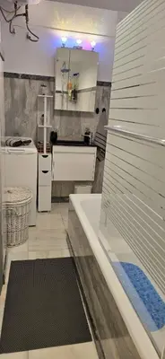 a kitchen with a sink and a refrigerator at Syntagma Plaka Getaway Apartment in Athens