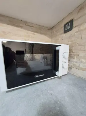 a large flat screen tv in a living room at Anastasia's apartment with yard in Athens