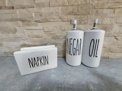 two white tanks sitting next to a brick wall at Anastasia's apartment with yard in Athens