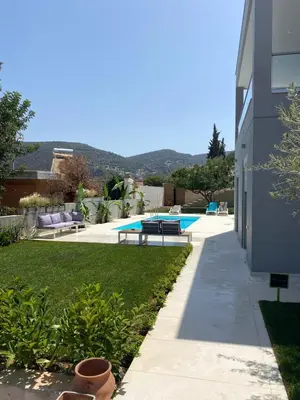 a yard with a swimming pool and a building at Porto Rafti Dream Complex & Retreat in Porto Rafti