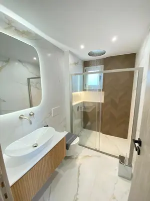 a bathroom with a sink and a shower at Porto Rafti Dream Complex & Retreat in Porto Rafti
