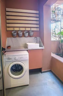a laundry room with a washing machine and a sink at Little gem in the historical center of Athens in Athens
