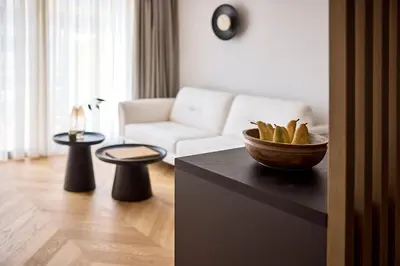 a living room with a bowl of bread on a counter at Cama Luxury Suites Kavouri in Athens