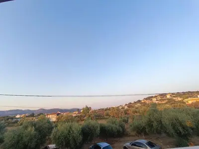 a view of the ocean from a parking lot at New Olivka House in Anavissos