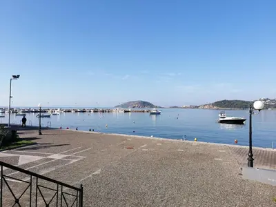 a large body of water with boats in it at New Olivka House in Anavissos