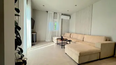 a living room with a couch and a table at Sand by Aestas Suites in Artemida