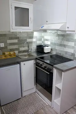 a kitchen with a sink and a stove at Melina’s Flat in Athens