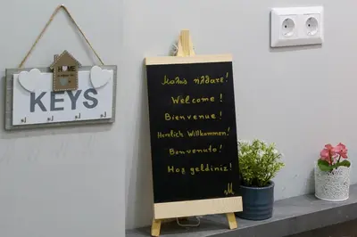 a chalkboard sign on a shelf in a room at Melina’s Flat in Athens